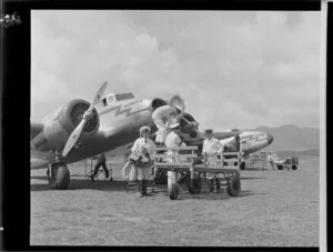 New Zealand National Airways Corporation, loading freight on to the Koweka and the Kawatere aircraft at Paraparaumu Airport