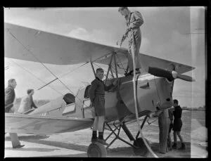 Peter Cunningham refuelling Tiger Moth aircraft