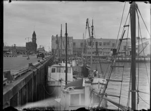 Fishing boats at market wharves, Auckland, looking towards the Ferry building, Quay Street