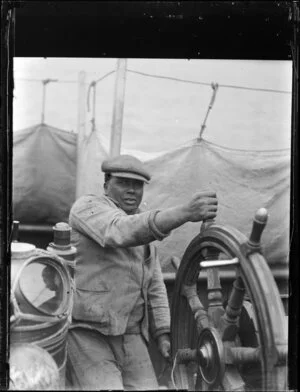 Charlie Jackson at the wheel of the whaling boat, Hananui II