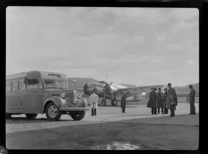 Passengers waiting to embark a New Zealand National Airways Corporation plane at Taieri Aerodrome