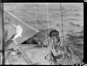 Sid Irving with flag with picture of a marlin on it