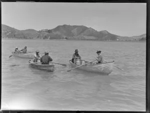 People rowing on the sea, with milk containers in the boats, Bay of Islands