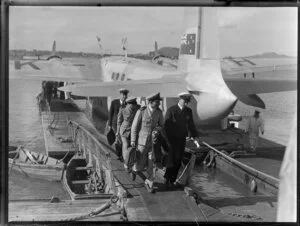Crew deplaning from flying boat RMA Auckland at Mechanics Bay, Auckland