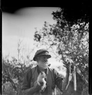 Rural scene with a man and kitten