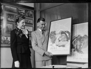 Mary Wootton (Miss New Zealand) with Leo White and a BOAC (British Overseas Airways Corporation) poster, at Whites Aviation offices, Auckland