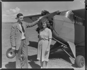 H R 'Sam' Morton and his sister Roz Morton by Rearwin Sportster aeroplane ZK-AIP