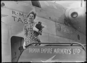 Mary Wootton (Miss New Zealand) outside a Tasman Empire Airways Ltd aeroplane