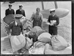 Mail being loaded or unloaded from Tasman Empire Airways Ltd seaplane