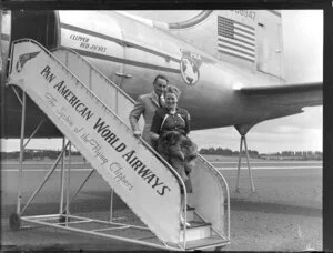 Mr and Mrs Magel alongside Pan American World Airways aeroplane Clipper Red Jacket