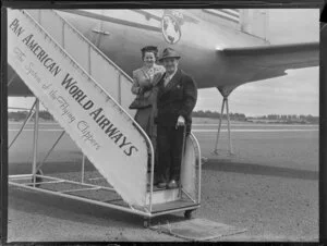 Mr and Mrs Miller alongside Pan American World Airways aeroplane Clipper Red Jacket