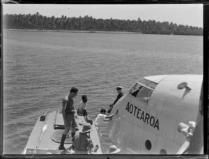Boat drawn up beside the seaplane Aotearoa in Suva