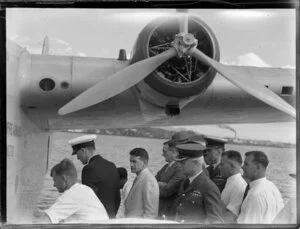 A group of men examine the seaplane Aotearoa in Suva