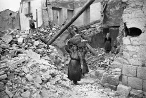 Unidentified women clearing away wreckage in the village of Gessopalena, Italy