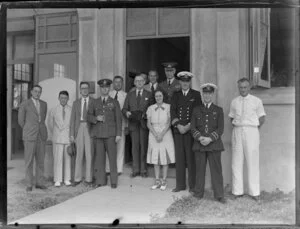 Group of men, some in uniform, and one woman, Suva, Fiji, for seaplane Aotearoa survey flight