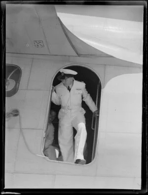 Man in door of aeroplane, Hobsonville