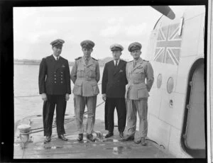 Messrs Griffiths, Coulson and Garden standing alongside a seaplane aircraft