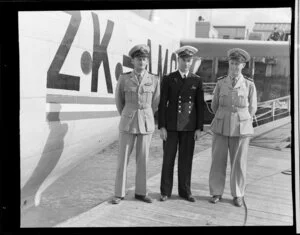 Messrs Griffiths, Coulson and Garden standing alongside a seaplane aircraft
