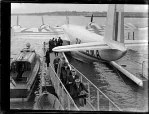 Passengers disembarking from aircraft, Mechanics Bay, Auckland
