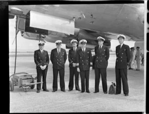 Crew of the Constellation aircraft from left to right, Mr Stark, Mr Rowe, 1st officer Edwards, Captain Ritchie, Mr R F Lander, Mr C J Patterson