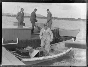 Unidentified men, boarding a small boat, Centaurus, Imperial Airways Ltd