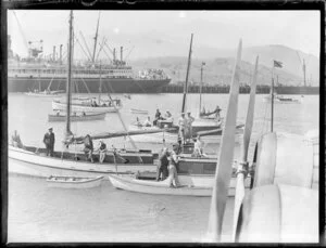 Small boats welcoming the flying boat, Centaurus, Lyttelton Harbour