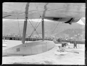 Dinghies, rowing towards the flying boat, Centaurus, Wellington Harbour
