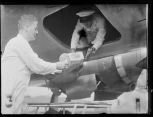 Loading the Special Auckland Cup film on to Pan American World Airways Clipper