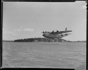 Flying boat ZK-AMB, Tasman Empire Airways Ltd, taking off from Auckland harbour