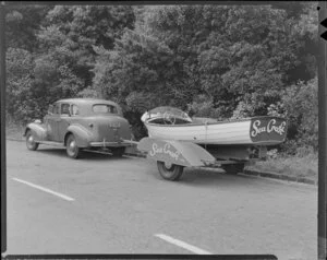 Car towing a trailer with a Sea Craft Ltd speedboat