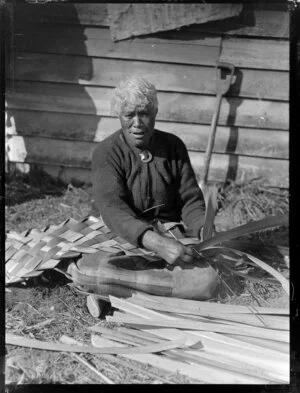 Hurihia weaving flax, location unidentified