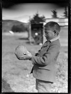 Maori boy with a rugby ball, Waikato