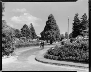 Unidentified couple strolling through Government Gardens, Rotorua