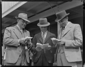 Dominion Trotting Championship, unidentified man with Messrs R A McMillan (centre) and O E Hooper (left), Auckland