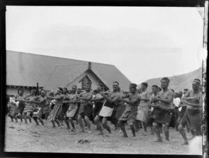 Group of Māori men performing a haka at Pakirikiri Marae, Tokomaru Bay