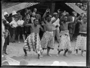 A group of Maori men performing a haka at the marae, location unidentified