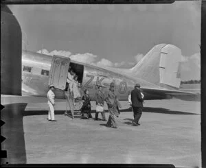 New Zealand National Airways Corporation, disembarking passengers, Whenuapai Aerodrome, Auckland,