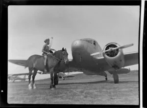 Cessna aircraft at Mangere aerodrome, Auckland, including Blakey Harris on horseback