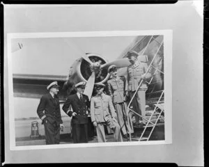 Air crews (left to right), Tasman Empire Airways Ltd, Captain J Shepherd, R/O E Roberts, R/O J Jackson and Trans Australia Airlines, Captain E McDonald, Whenuapai Aerodrome, Auckland