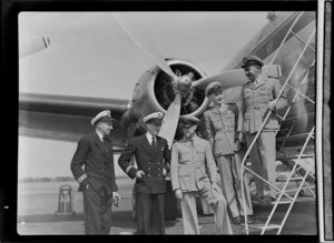 Air crews (right to left), Tasman Empire Airways Ltd, Captain J Shepherd, R/O E Roberts, R/O J Jackson and Trans Australia Airlines, Captain E McDonald, Whenuapai Aerodrome, Auckland