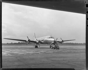 Australian National Airways, aeroplane, Warana, being towed to a hangar