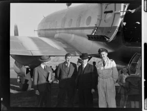 John Gamble, left, with Squadron Leader HG Hazelden, pilot, Minister of Defence Fred Jones, and Flight Lieutenant D Broomfield, co-pilot, alongside Handley Page Hastings airplane, location unidentified