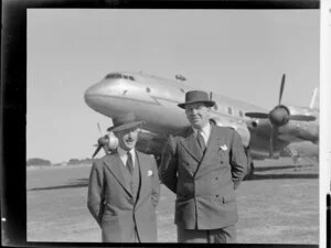 John Gamble, left, with Nick Higgs, Handley Page Hastings airplane in background, location unidentified