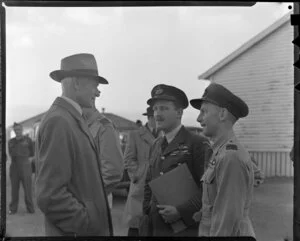 Sir Keith Park chatting to Wing Commander E W Tacon and Air Commodore E H Fielden, King's flight, Whenuapai Air Base, Waitakere City, Auckland