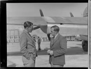 Mr Neville Jackson, pilot, New Zealand National Airways Corporation, left, with Mr AV Jury, Department Operations Manager, Tasman Empire Airways Limited, location unidentified