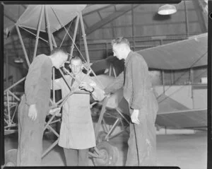 Flight Sergeant R H Blower instructing the fundamentals of air frame mechanics to AC2 J H Dunkley and LAC R Brooke, Hobsonville Technical Training School