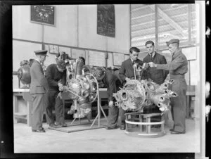 Instruction on single and twin Pratt and Whitney Wasp engines. Flying Officer W J Houghton, officer I C engines; AC2 J E Berdineer, AC2 M R Braithwaite, AC2 S W Beck, AC2 W T Baguley and Flight Sergeant H Dickson BEM, Hobsonville Technical Training School