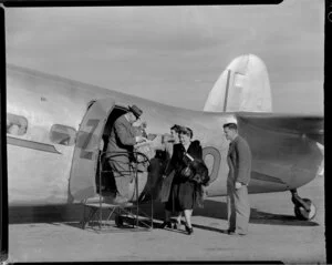 New Zealand National Airways Corporation, passengers disembarking from Lodestar aircraft at Whenuapai Aerodrome, Auckland