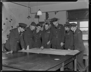 Briefing crews of No 41 Transport Squadron at Whenuapai, Auckland, from left are Flight Lieutenants H J Hammond, K B Smith, J B Nicholls, I R Mitchell, C F Ormerod, P R Ross, D J Phillips