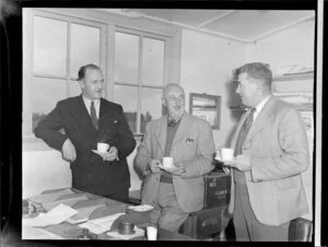 Len Poore and Hume D Christie, members of the Canterbury Aero Club, with S Livingstone from Civil Aviation